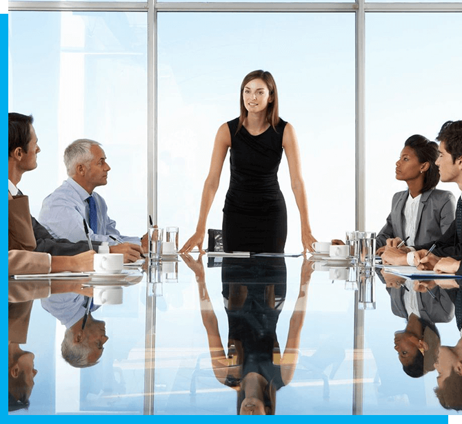 A group of people sitting around a table.