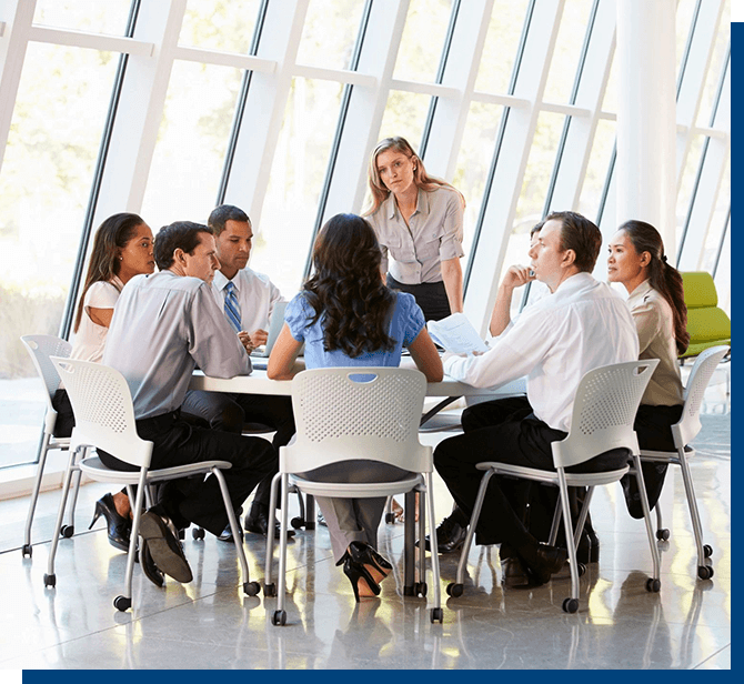 A group of people sitting around a table.